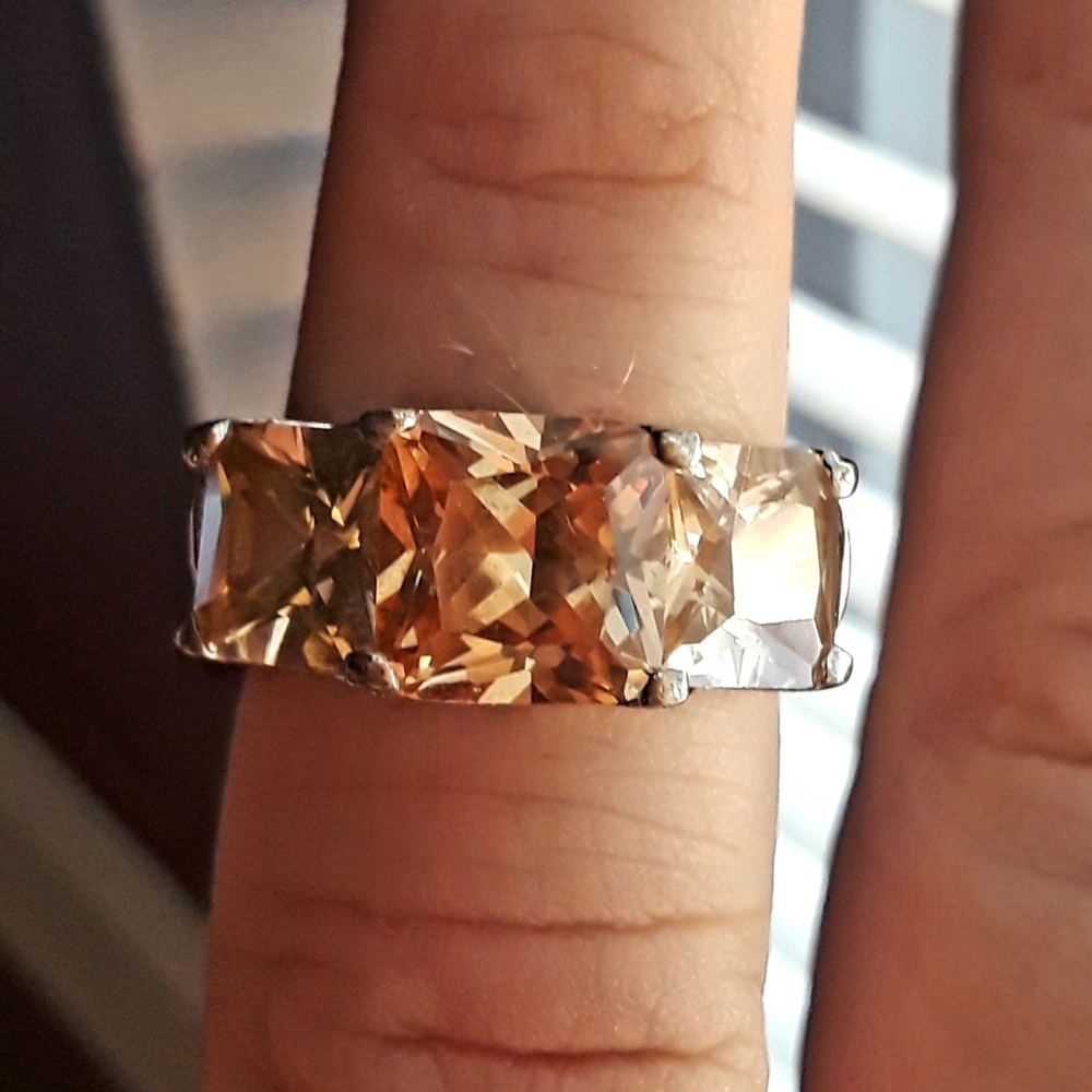Peach colored stone and faux diamond ring